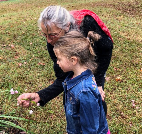 Wendi teaching a child about native plants