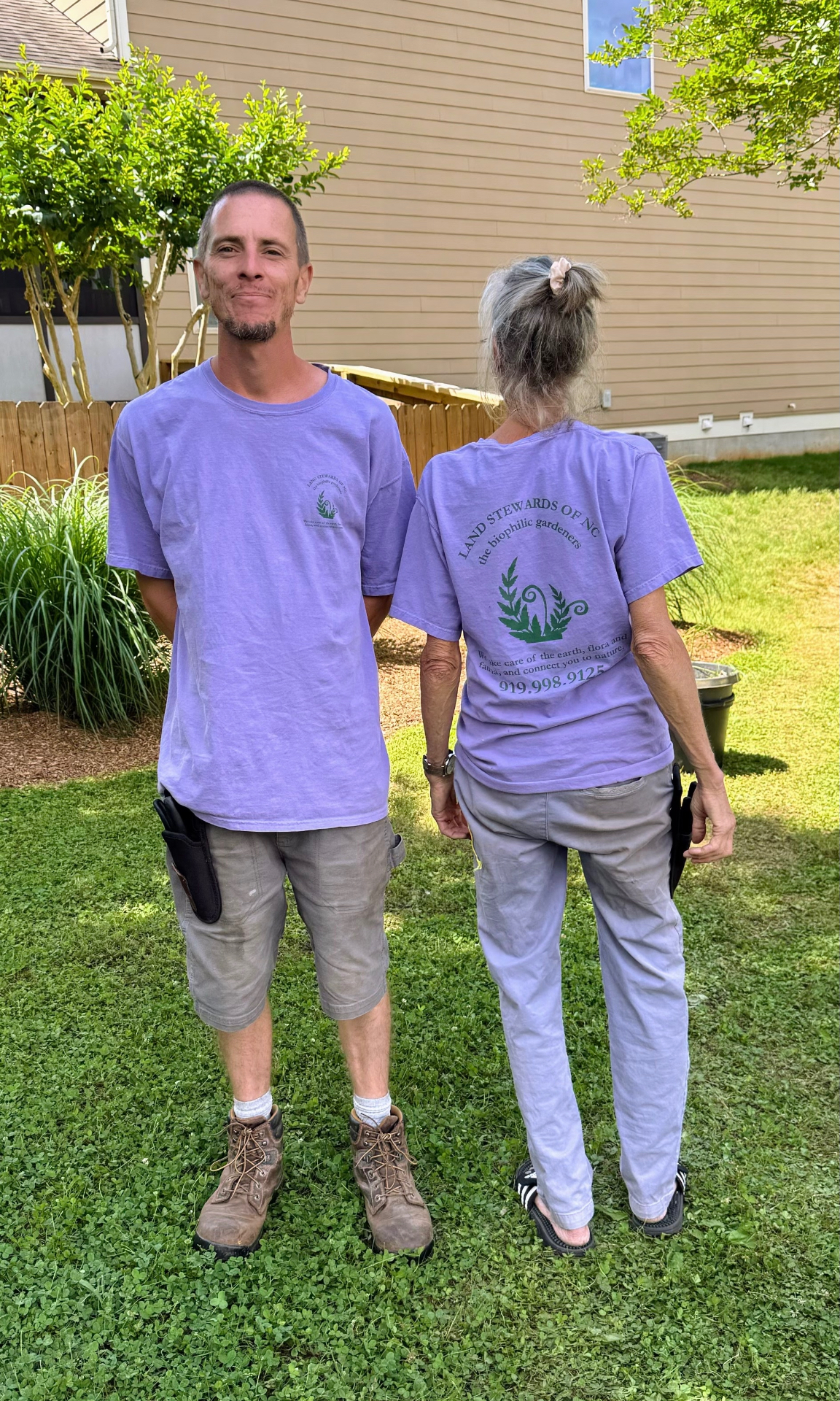 Wendi planting alongside a crew member